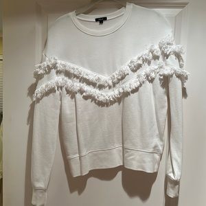 White sweater with fringe design